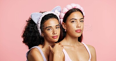 Buy stock photo Serious, skincare and portrait of girl friends in studio for natural, beauty or cosmetic for wellness. Face, support and female people with dermatology for facial glow or hydration by pink background