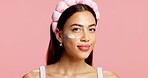Portrait, woman and lotion for skincare in studio for swatch test, hydration and healthy skin. Smile, person and cream for moisturizing, smooth textures and spf cosmetics for shine on pink background