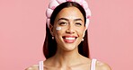 Portrait, woman and sunscreen for skincare in studio for hydration, healthy skin and collagen. Smile, person and cream for moisturizing, smooth textures and spf treatment for shine on pink background