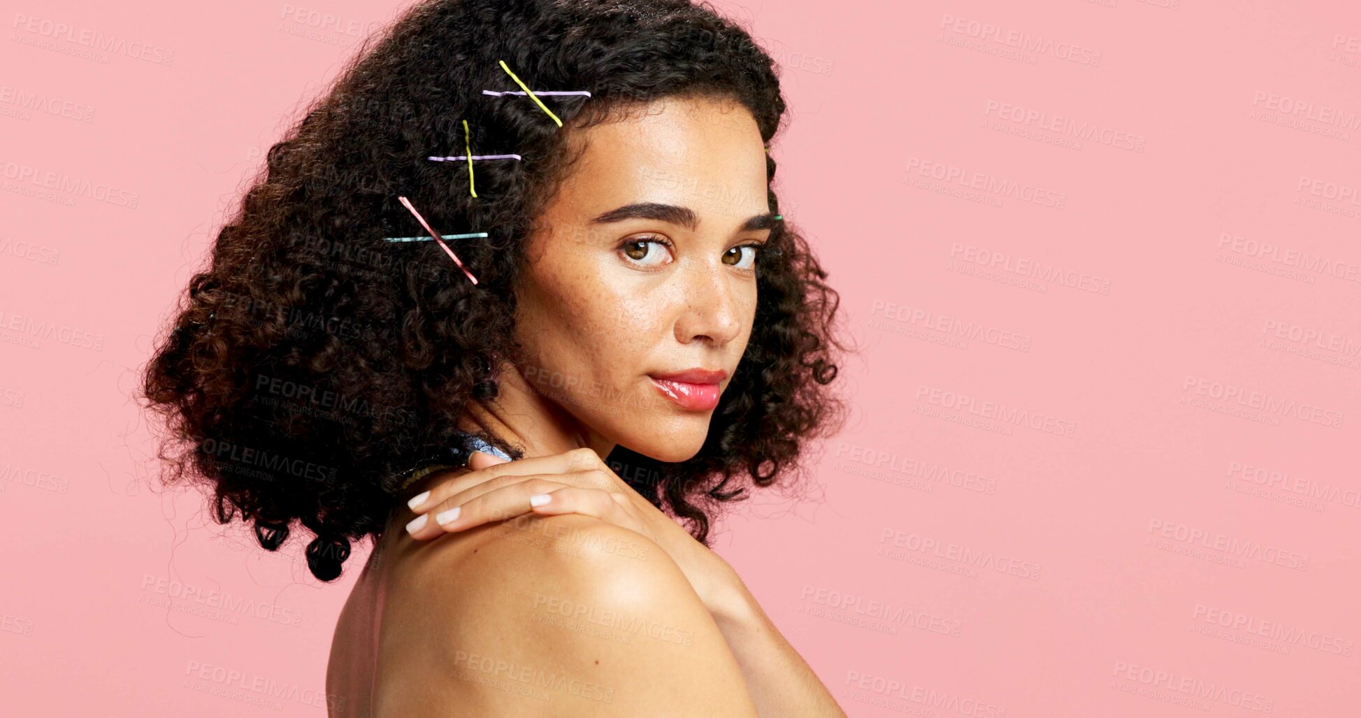 Buy stock photo Portrait, skincare and woman in studio, glow and dermatology with curly hair on pink background. Mockup space, gen z or person with shine, wellness or cosmetics with hairstyle, healthy skin or beauty