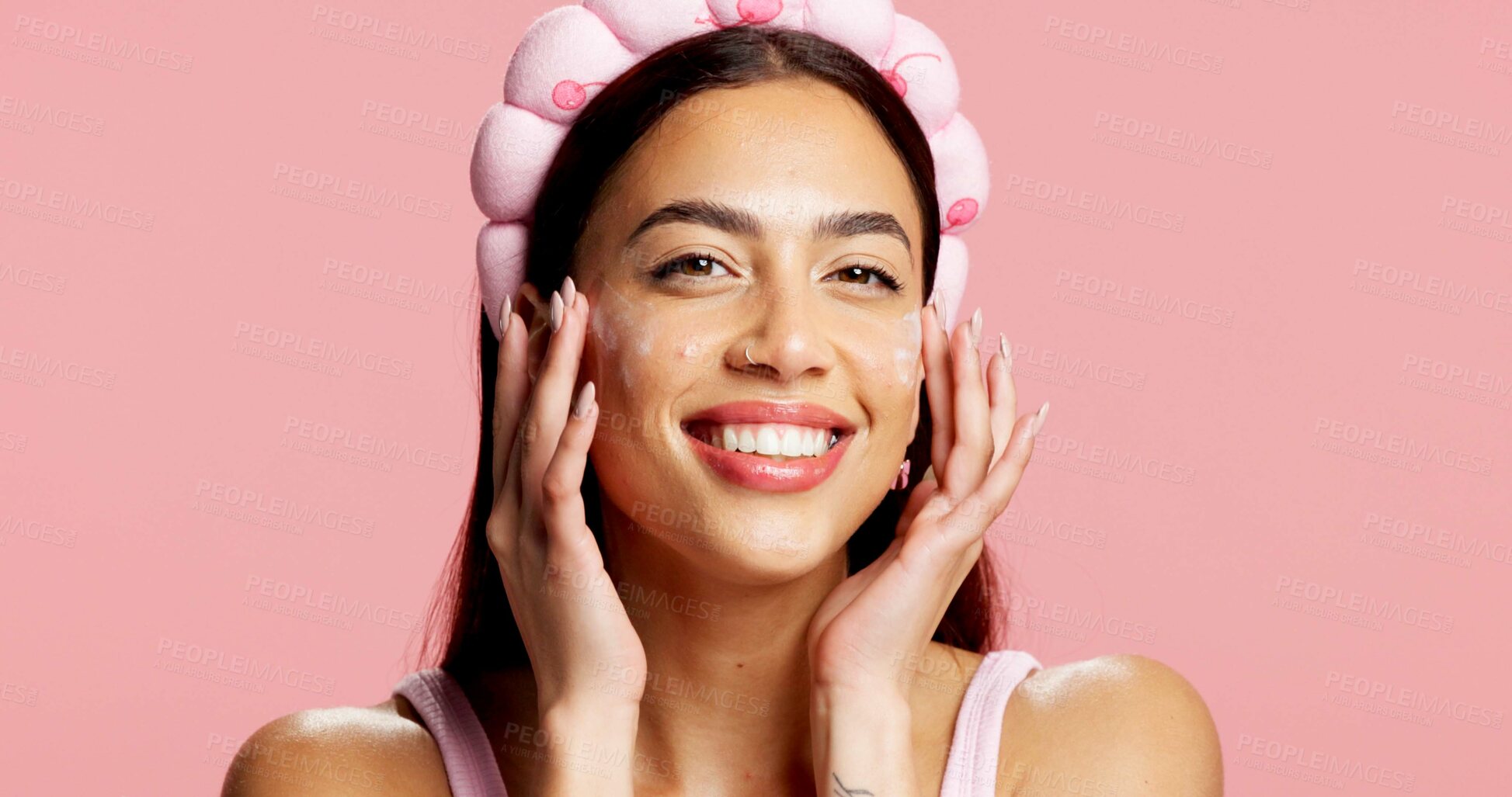 Buy stock photo Portrait, woman and sunscreen for beauty in studio for hydration, healthy skin and collagen. Smile, person and lotion for skincare, smooth textures and sunblock treatment for shine on pink background