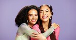 Hug, beauty and smile with portrait of friends in studio for support, skincare and aesthetic glow. Bonding, gen z connection and cosmetology with women on purple background for self care and shine