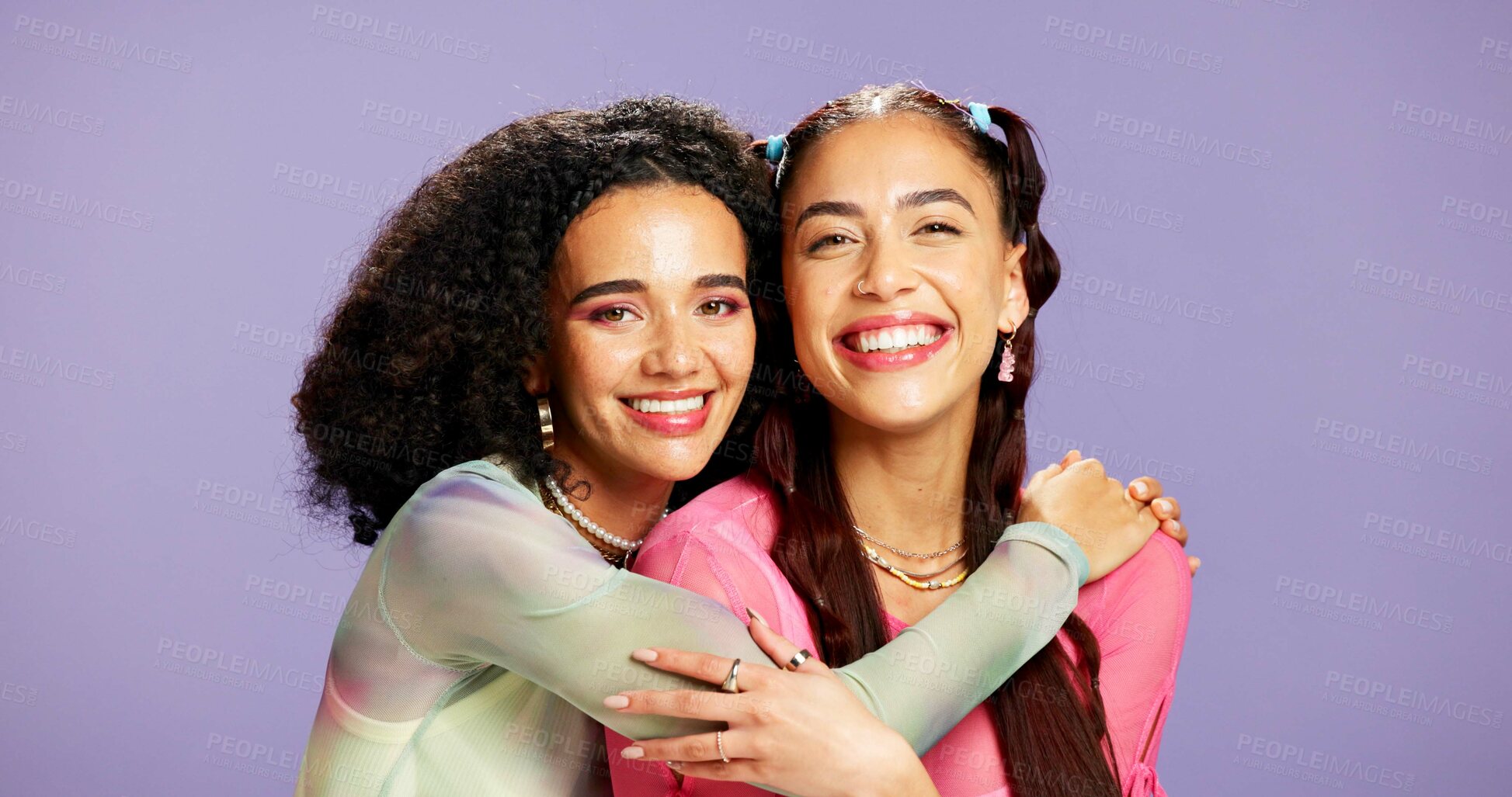 Buy stock photo Hug, beauty and smile with portrait of friends in studio for support, skincare and aesthetic glow. Bonding, gen z connection and cosmetology with women on purple background for self care and shine