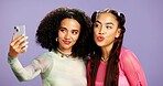 Gen z, selfie and friends in studio with pout, makeup and facial cosmetology together. Smile, love and women with beauty for social media, online post and cosmetics for bonding by purple background