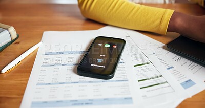 Buy stock photo Documents, phone screen and ringing with person at desk in home office for accounting or finance. Communication, paperwork and remote work with mobile on table in apartment for call or contact