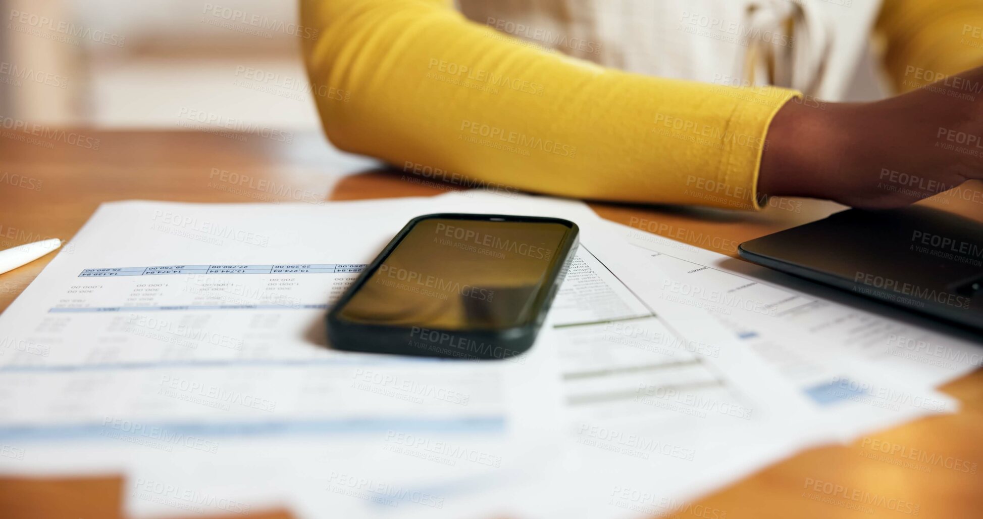 Buy stock photo Alarm, documents, phone screen with person at desk in home office for accounting or finance. Alert, paperwork and remote work with mobile notification on table in apartment for communication