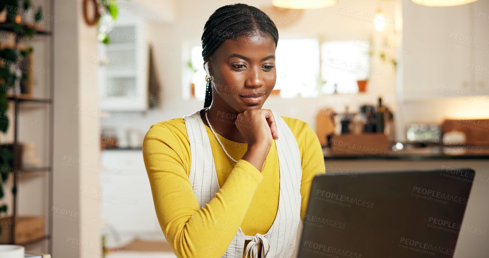 Buy stock photo Laptop, remote work and planning with black woman at desk in home for startup feedback or research. Computer, reading and thinking with African freelancer in apartment for small business review