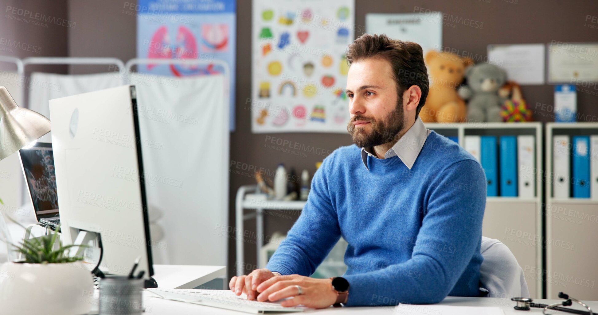 Buy stock photo Healthcare, man and doctor with computer for typing report, email or patient history. Person, pediatrician and medical professional with desktop in clinic for schedule, insurance info or research