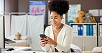 Black woman, doctor and reading with phone in office for research, contact patient and medical results. Pediatrician, mobile and communication for telehealth, schedule checkup and healthcare report