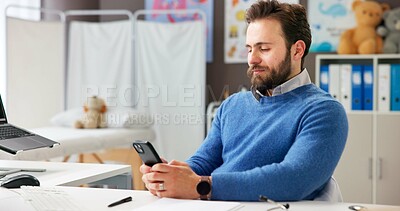 Buy stock photo Man, doctor and reading with phone in office for research, contact patient and medical results. Pediatrician, mobile app and communication for telehealth, schedule appointment and healthcare report