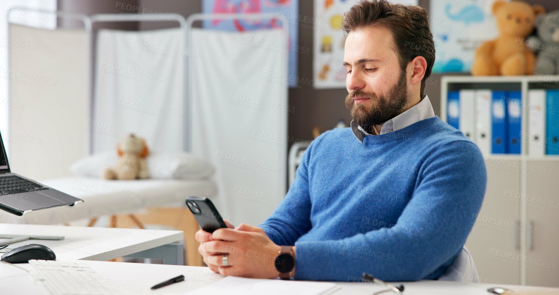 Buy stock photo Man, doctor and reading with phone in office for research, contact patient and medical results. Pediatrician, mobile app and communication for telehealth, schedule appointment and healthcare report