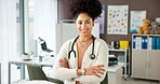 Woman, pediatrician and happy with arms crossed at clinic, pride or child wellness expert in office. Person, doctor and healthcare professional with smile, confident and career at hospital in Brazil