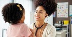Appointment, medical or stethoscope with doctor and patient in hospital for consulting or exam. Checkup, healthcare or heartbeat with girl child and pediatrician in clinic for pulse assessment