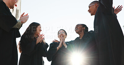 Buy stock photo Group, graduation and applause with low angle at university for success, support and circle with flare. People, students and happy with sky for celebration, achievement or education goals at college