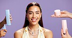 Hands, portrait and product with happy woman in studio for beauty recommendation or review. Container, promotion and skincare with model isolated on purple background for cosmetics or dermatology