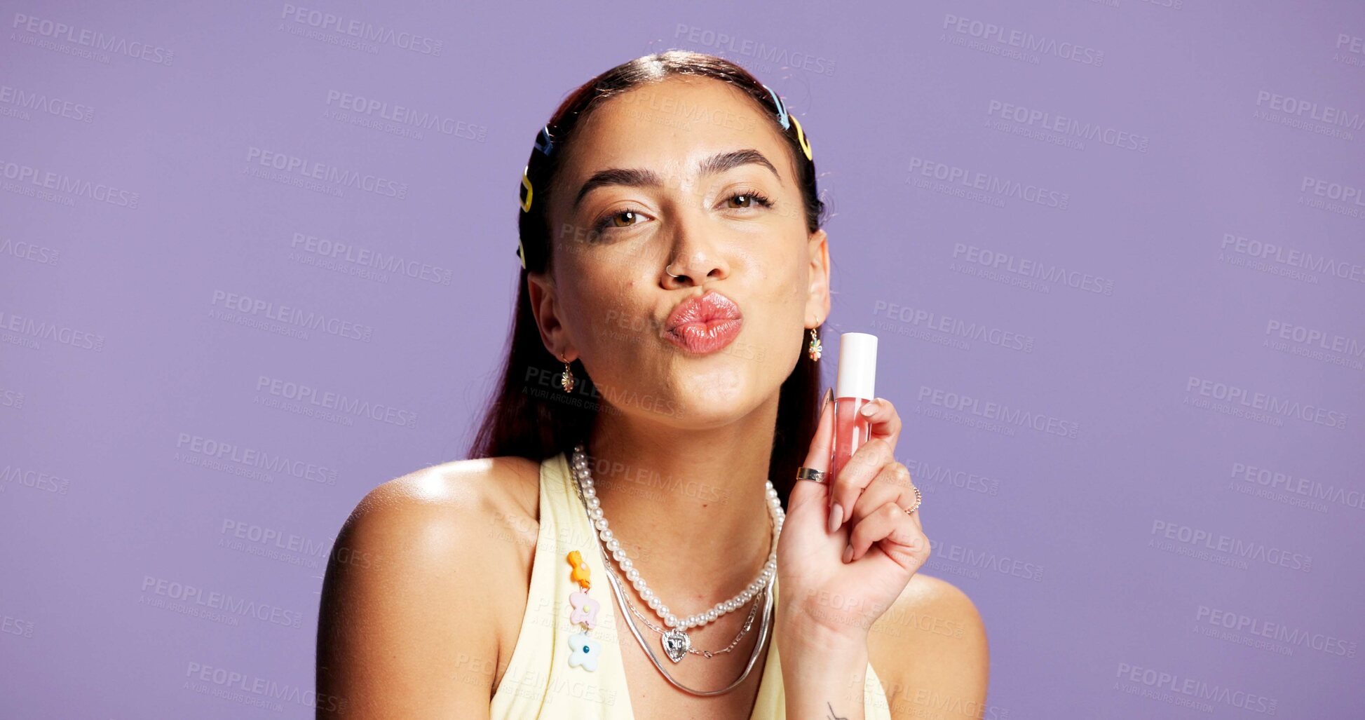 Buy stock photo Lipgloss, pout and portrait of woman in studio for cosmetics, peptide treatment and beauty maintenance. Self care, glow and makeup product with person on purple background for shine, kiss and gen z