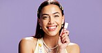 Lipgloss, smile and portrait of woman in studio for cosmetics, peptide treatment and beauty maintenance. Self care, glow and makeup product with person on purple background for shine and gen z
