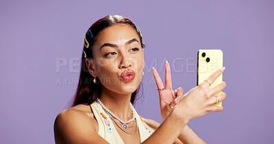 Buy stock photo Beauty, peace sign and selfie with influencer woman in studio for product review on social media. App, haircare and pout of gen z content creator isolated on purple background for post or update