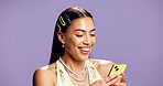 Woman, phone and texting with fashion, studio and happy with mockup space on purple background. Gen z person, smartphone and mobile app with online dating, style and scroll web chat on social media