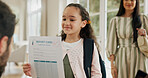 Home, pride and parents with girl, report card and education with growth, support and excited. Apartment, mother and father with daughter, good grades and knowledge with success and academic progress