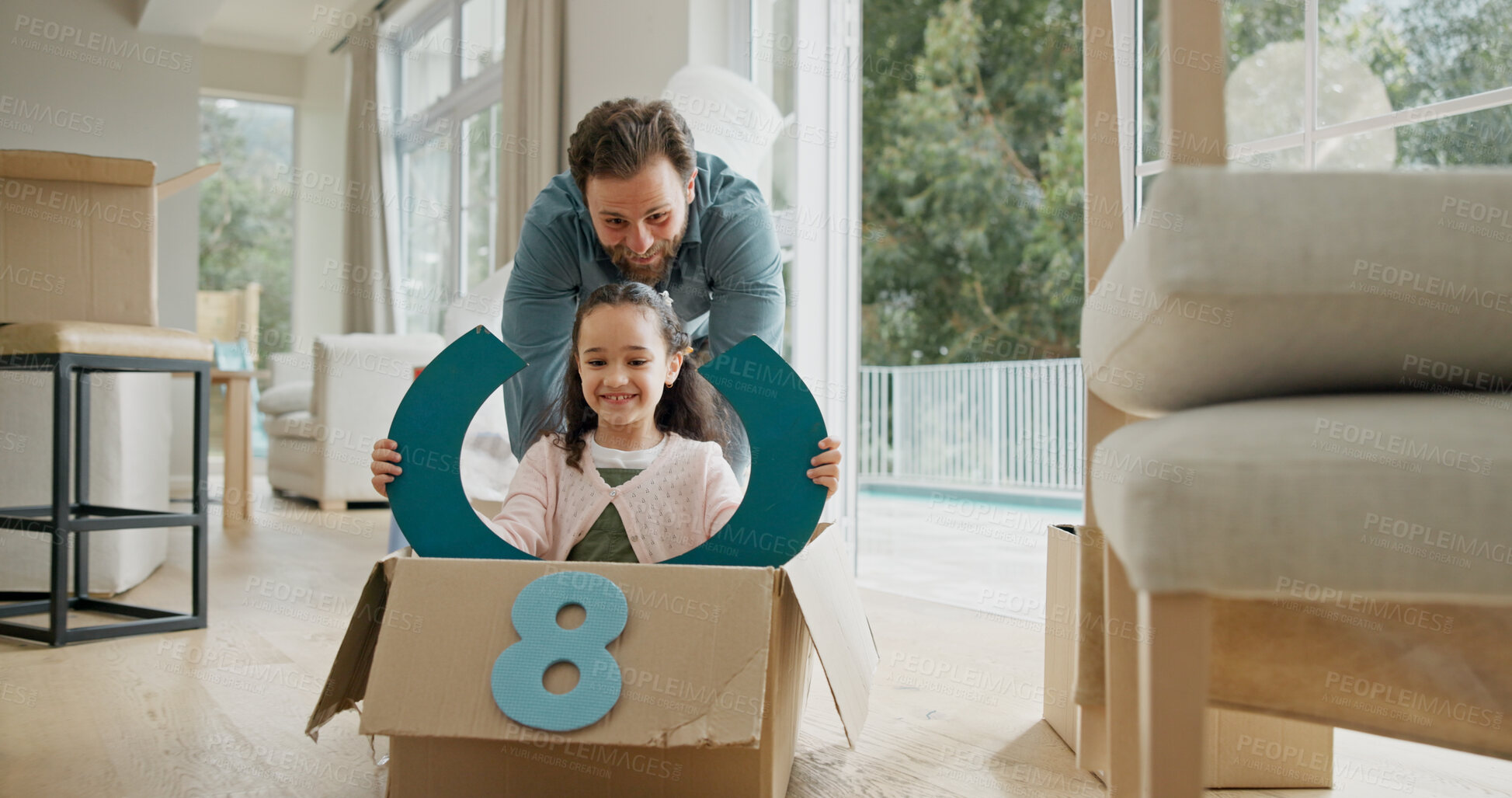 Buy stock photo Father, child or riding in box in new home for property investment, game or mortgage security. Family house, excited people and push with fantasy steering wheel for relocation fun and bonding