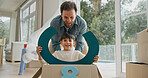 Father, child or playing in box in new home for property investment, race game or mortgage security. Family house, portrait or excited people with fantasy steering wheel for relocation fun or bonding