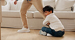 Play, lounge and child hanging to leg, separation anxiety or dependance for adjustment comfort. Clingy behavior, connection or man with boy in new home for support,  attachment or safety in attention