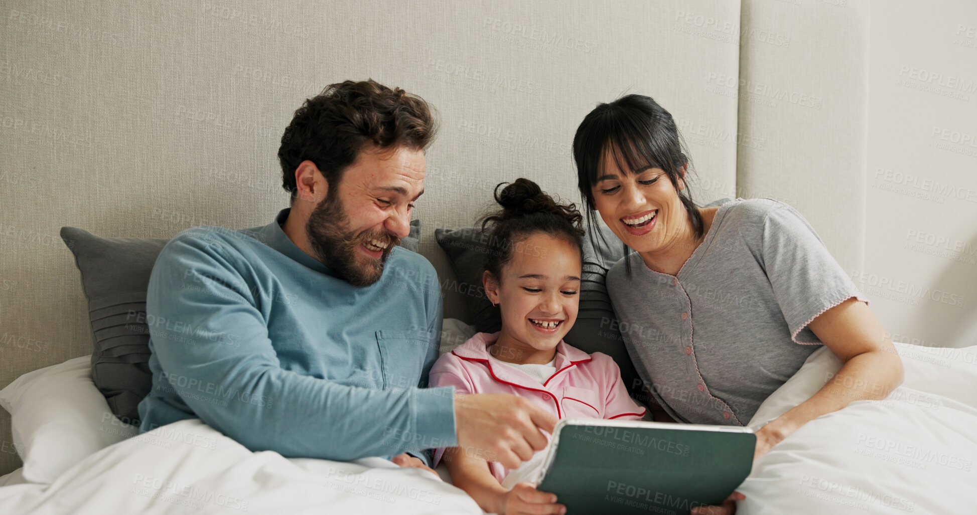 Buy stock photo Parents, girl and tablet in bed, laugh and bonding for online streaming, film and subscription in home. People, mom and dad with child, tech or pyjamas with app for cartoon movie at family house