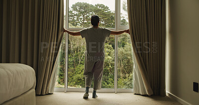 Buy stock photo Morning, window and back of woman in hotel room for wake up routine, accommodation getaway and relax. Curtain, hospitality and view with person in house rental for comfortable, trip and sunrise