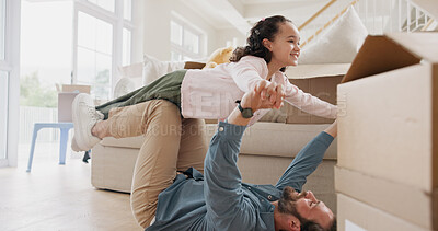 Buy stock photo Moving, child and man playing airplane in new home, real estate and happy bonding in family house. Lounge, property investment and father lifting girl in air, flying game and connection for support