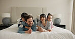 Parents, children and portrait on bed with play, smile and bonding for love with pyjamas at house. People, mom and dad with kids, happy or relax in morning, care and laugh at family home in Spain