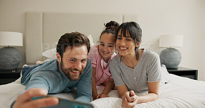 Buy stock photo Child, parents and selfie with happy family in bedroom, bonding together and social media update. Mother, father and picture with girl in bed at home for love, memory and relax in morning with photo