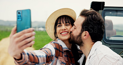Buy stock photo Travel, couple and kiss in selfie at car for road trip memory, social media post and journey break. Bonding, happy people and photography in countryside for romantic getaway or profile picture update