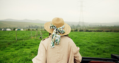 Buy stock photo Travel, back and person on field with view, agriculture and scenery on holiday trip. Tourism, mountain and tourist in countryside with hat, farming vacation and outdoor journey in rural getaway.