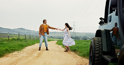 Buy stock photo Outdoor, dancing and couple with love, travel and romance with relationship, care and trust. Road trip, vehicle and man with woman, holding hands and holiday with nature, marriage and anniversary