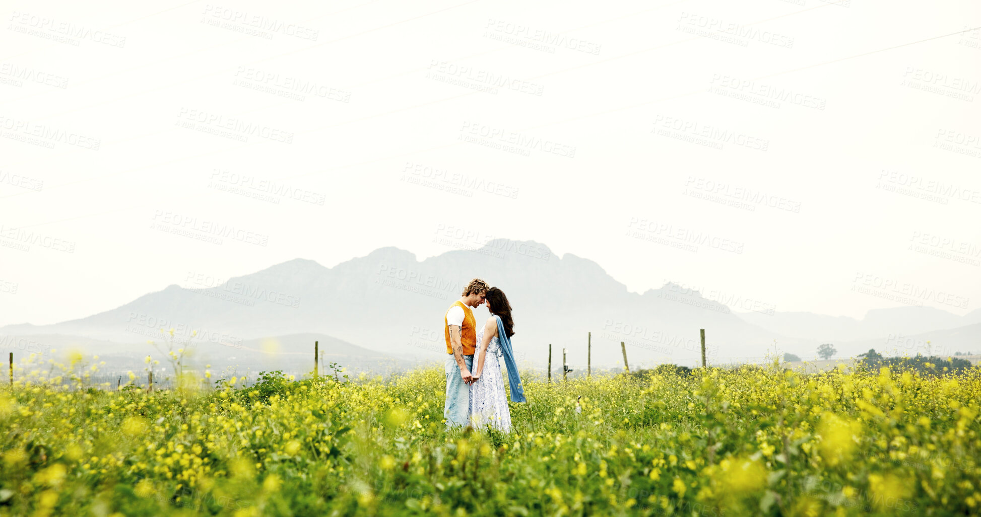 Buy stock photo Love, couple and forehead touch on field for connection, care or holding hands with space on holiday. Romance, man and woman in countryside with flowers on vacation, commitment and together outdoor