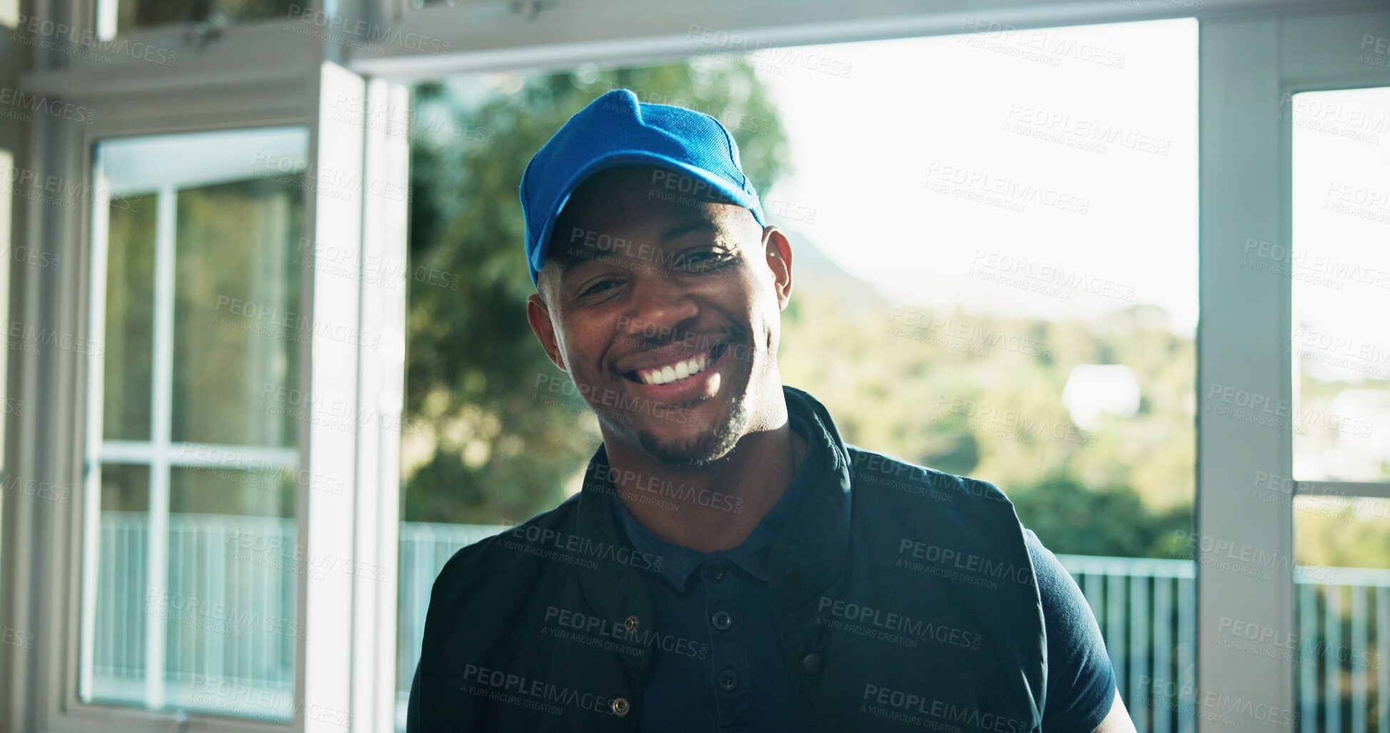 Buy stock photo Portrait, relax or black man with smile in home for peaceful morning, positive attitude or calm weekend. Happiness, resting indoor or person with cap by balcony door, holiday or chill on staycation