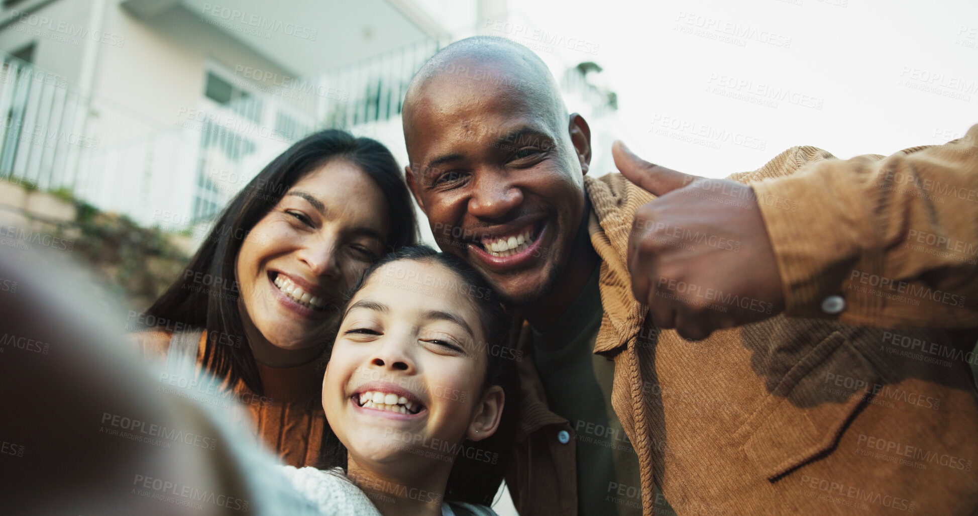 Buy stock photo New home, backyard and selfie of parents with child for bonding, support and happy for relocation. Interracial family, pov and portrait of mom, dad and girl with thumbs up for love, memory and photo