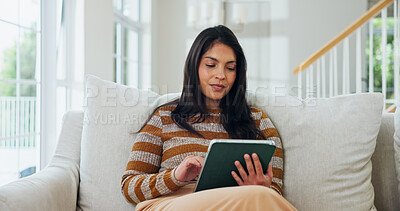 Buy stock photo Reading, tablet and relax with woman on sofa for social media, communication and network app. Contact, connection and online chat with person in living room of home for comment on post and scroll