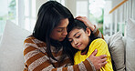 Woman, girl and crying with hug on sofa for comfort, care and support for mental health in living room. People, mother and daughter with embrace, connection or console on couch at family house