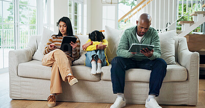 Buy stock photo Home, technology and family with girl, sad and upset with internet, neglect and addiction. Apartment, parents or mother on sofa, father and daughter with tablet, distracted or network with depression