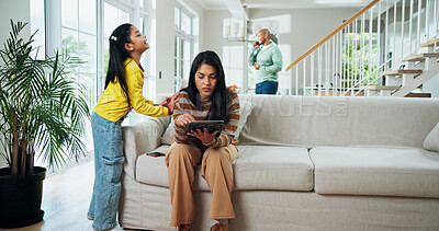 Buy stock photo Girl, mother and ignore on sofa with tablet addiction, scroll and social media in living room in home. Parents, tech and child with talk, frustrated or ask for attention in lounge at family house