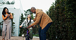 Parents, bicycle and teaching girl with phone, smile and recording video for memory, outdoor and bonding. People, mother and father with child, smartphone or photography with learning balance on bike
