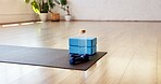 Yoga, water and block with dumbbells in studio for fitness, empty room and wellness class. Pilates session, electrolyte bottle and interior of health club for training weights, holistic and gym