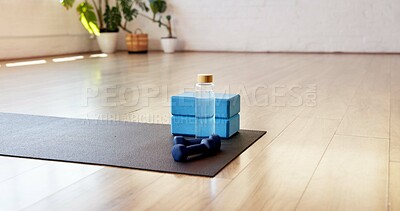Buy stock photo Yoga, water and block with dumbbells in studio for fitness, empty room and wellness class. Pilates session, electrolyte bottle and interior of health club for training weights, holistic and gym