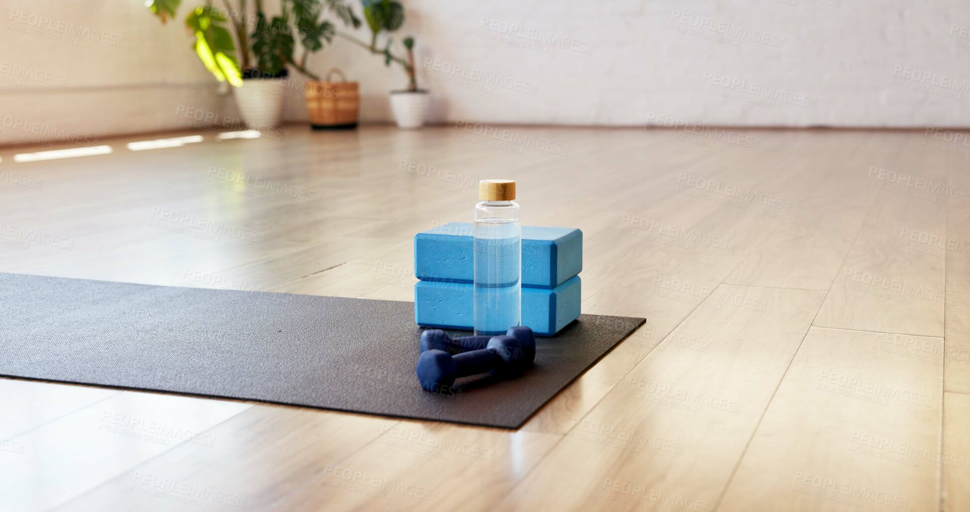 Buy stock photo Yoga, water and block with dumbbells in studio for fitness, empty room and wellness class. Pilates session, electrolyte bottle and interior of health club for training weights, holistic and gym