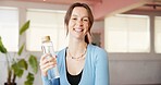 Portrait, water bottle and yoga with woman in studio for fitness, holistic health or wellness. Balance, drink and hydration with happy yogi person in class for commitment or dedication to exercise