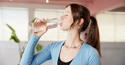 Buy stock photo Drinking water, yoga and relax with woman in studio for workout, hydration or wellness beverage. Fitness break, pilates center and mineral drink with person and bottle in class for holistic and detox