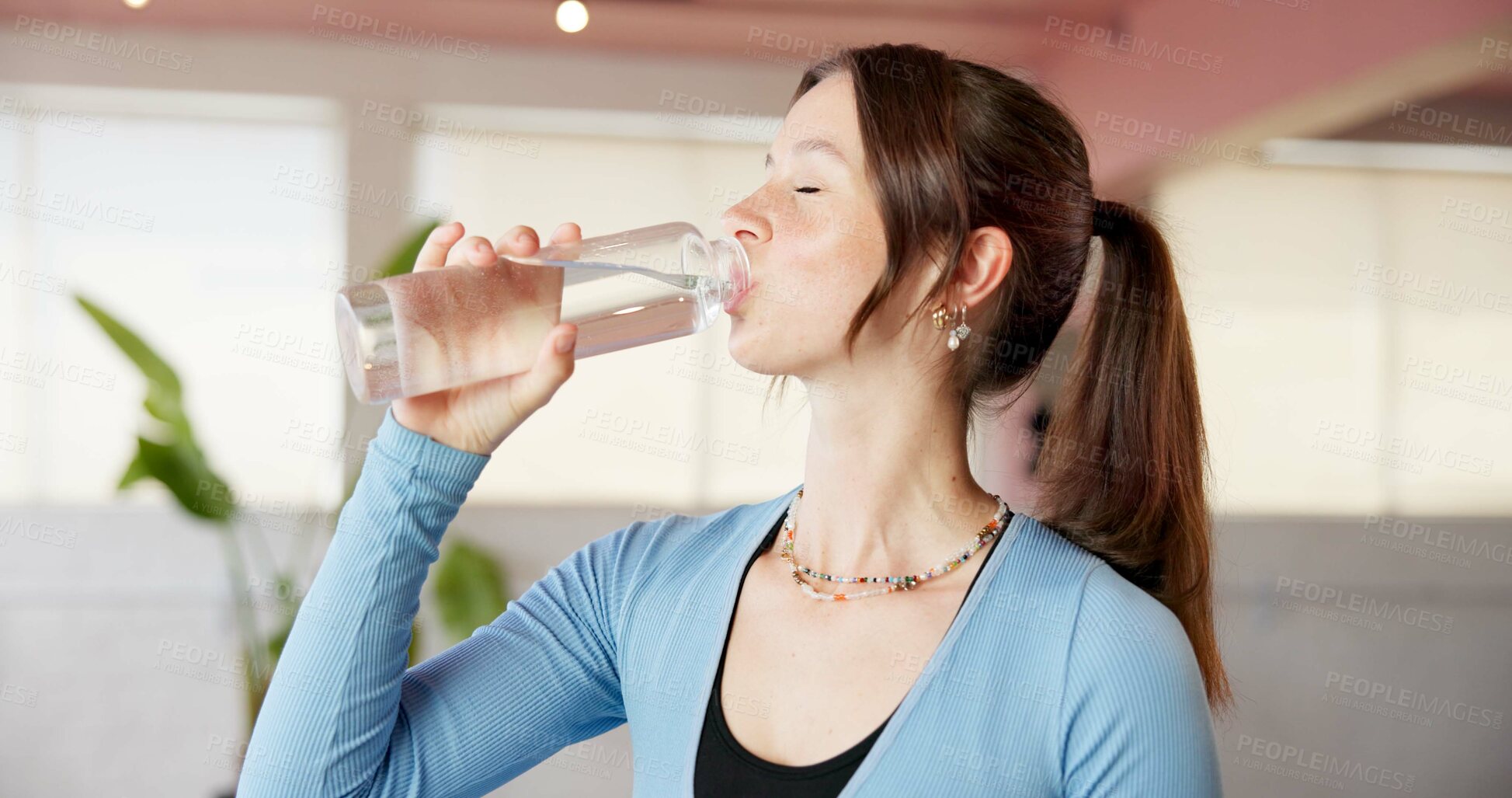 Buy stock photo Drinking water, yoga and relax with woman in studio for workout, hydration or wellness beverage. Fitness break, pilates center and mineral drink with person and bottle in class for holistic and detox