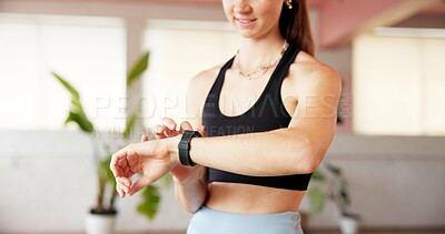 Buy stock photo Woman, hands or smart watch in gym for exercise, tracking heart rate or fitness progress app. Person, reading or check time in studio with workout results, wellness or monitor step counter for goals.